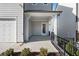 Covered patio with concrete flooring and metal railing at 1936 Stanfield Nw Ave, Atlanta, GA 30318