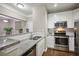 Modern kitchen with granite countertops and stainless steel appliances at 10 Perimeter Summit Ne Blvd # 3412, Brookhaven, GA 30319