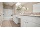 Double vanity bathroom with granite countertops and white cabinets at 10 Perimeter Summit Ne Blvd # 3412, Brookhaven, GA 30319