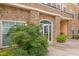 Attractive building entrance with stone accents and landscaping at 10 Perimeter Summit Ne Blvd # 3412, Brookhaven, GA 30319
