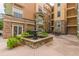 Community courtyard with a fountain and seating area at 10 Perimeter Summit Ne Blvd # 3412, Brookhaven, GA 30319