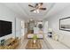 Open living room with hardwood floors and view of kitchen at 10 Perimeter Summit Ne Blvd # 3412, Brookhaven, GA 30319