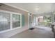 Front porch with a wooden swing and light fixture at 972 Sims Nw Ave, Atlanta, GA 30318