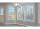 Bright dining area with a view and new light fixture at 2869 Cardinal Trce, Duluth, GA 30096