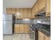 Kitchen with stainless steel appliances and wood cabinets at 2869 Cardinal Trce, Duluth, GA 30096