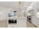 High-end kitchen with white cabinets, stainless steel appliances, and hardwood floors at 850 Camden Park Ct, Atlanta, GA 30342