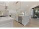 Gourmet kitchen with white cabinets, marble countertops, and high-end stainless steel appliances at 850 Camden Park Ct, Atlanta, GA 30342