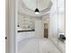 Spa-like main bathroom with white cabinetry, glass shower, and soaking tub at 850 Camden Park Ct, Atlanta, GA 30342