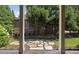 View of the backyard from covered porch, showcasing stone pathway and landscaping at 850 Camden Park Ct, Atlanta, GA 30342
