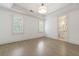 Spacious bedroom with hardwood floors, plantation shutters and ensuite bathroom at 850 Camden Park Ct, Atlanta, GA 30342
