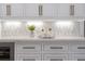 White kitchen cabinets with gold hardware and geometric backsplash tile at 850 Camden Park Ct, Atlanta, GA 30342
