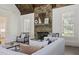Living room with stone fireplace, hardwood floors and comfortable seating at 850 Camden Park Ct, Atlanta, GA 30342