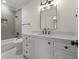 Modern bathroom with gray tile, white vanity, and black fixtures at 850 Camden Park Ct, Atlanta, GA 30342