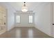 Large bedroom with hardwood floors, plantation shutters, and ensuite bath at 850 Camden Park Ct, Atlanta, GA 30342