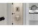 Modern powder room with white cabinetry and elegant fixtures at 850 Camden Park Ct, Atlanta, GA 30342