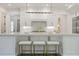 Modern kitchen with a large center island, white cabinets and gold accents at 850 Camden Park Ct, Atlanta, GA 30342