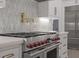 Modern kitchen features a stainless steel range and geometric backsplash at 850 Camden Park Ct, Atlanta, GA 30342