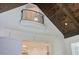 Open loft area with a charming balcony and dark wood ceiling beams at 850 Camden Park Ct, Atlanta, GA 30342
