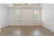 Bright bedroom with hardwood floors and two windows with plantation shutters at 850 Camden Park Ct, Atlanta, GA 30342