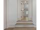 Light oak hardwood stairs leading to the upper level of the home at 850 Camden Park Ct, Atlanta, GA 30342