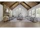 Spacious living room with stone fireplace, high ceilings, and hardwood floors at 850 Camden Park Ct, Atlanta, GA 30342