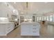 Bright white kitchen features a large island with seating and stainless steel appliances at 850 Camden Park Ct, Atlanta, GA 30342
