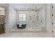 Luxurious bathroom with a large walk-in shower and a freestanding soaking tub at 850 Camden Park Ct, Atlanta, GA 30342