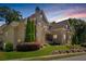 Brick home with stone accents and a beautifully landscaped yard at 850 Camden Park Ct, Atlanta, GA 30342