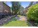 Landscaped backyard with stone patio and privacy fence at 850 Camden Park Ct, Atlanta, GA 30342