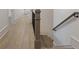 Long hallway with hardwood floors and neutral walls at 850 Camden Park Ct, Atlanta, GA 30342