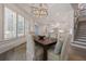 Elegant dining room with a wooden table and built-in seating at 850 Camden Park Ct, Atlanta, GA 30342