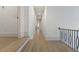 Hallway with hardwood floors and neutral walls at 850 Camden Park Ct, Atlanta, GA 30342