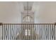 Elegant two-story foyer featuring a stunning light fixture and an ornate railing at 850 Camden Park Ct, Atlanta, GA 30342