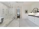 Spa-like bathroom with walk-in shower, freestanding tub, and herringbone tile at 850 Camden Park Ct, Atlanta, GA 30342