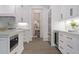 Modern kitchen with white cabinetry, marble countertops, and high-end appliances at 850 Camden Park Ct, Atlanta, GA 30342