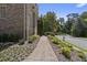 Sidewalk leading to home with landscaping and trees at 850 Camden Park Ct, Atlanta, GA 30342