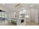 Elegant kitchen with white cabinets, marble countertops, and a built-in oven at 850 Camden Park Ct, Atlanta, GA 30342
