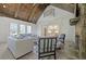Open living room with kitchen views, high ceilings and hardwood floors at 850 Camden Park Ct, Atlanta, GA 30342