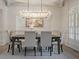 Elegant dining room with hardwood floors, chandelier and large windows at 850 Camden Park Ct, Atlanta, GA 30342