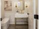 Stylish powder room featuring a marble vanity and gold accents at 850 Camden Park Ct, Atlanta, GA 30342
