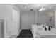 Modern bathroom with double vanity and black marble flooring at 3325 Piedmont Rd # 2203, Atlanta, GA 30305