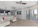 Spacious living room with white sectional sofa and access to balcony at 3325 Piedmont Rd # 2203, Atlanta, GA 30305