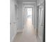 Light-filled hallway with hardwood floors and modern doors at 3325 Piedmont Rd # 2203, Atlanta, GA 30305
