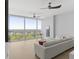 Living room with hardwood floors, white couch, and city view at 3325 Piedmont Rd # 2203, Atlanta, GA 30305