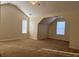 Spacious bedroom with vaulted ceiling, carpet, and ample natural light at 635 Beddick Ln, Atlanta, GA 30349