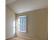Bright bedroom with large window and vaulted ceiling at 635 Beddick Ln, Atlanta, GA 30349