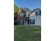 Brick and beige two-story house with a welcoming front entrance at 635 Beddick Ln, Atlanta, GA 30349