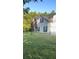 Two-story house with brick and siding, showcasing a well-maintained lawn at 635 Beddick Ln, Atlanta, GA 30349