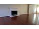 Living room boasts hardwood floors and a fireplace with a white mantel at 635 Beddick Ln, Atlanta, GA 30349