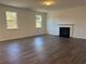 Large living room featuring hardwood floors and a fireplace at 108 Bloomfield Cir, Canton, GA 30114